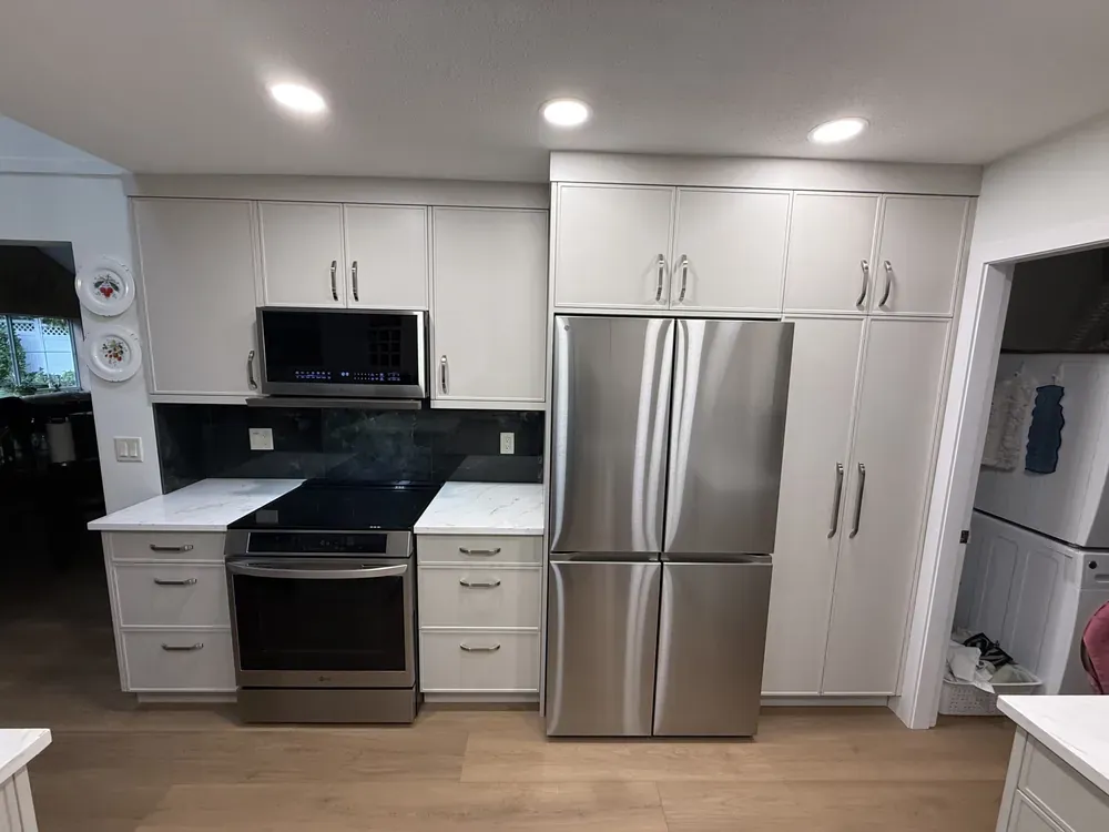 White cabinetry and quartz counters in Langley, after
