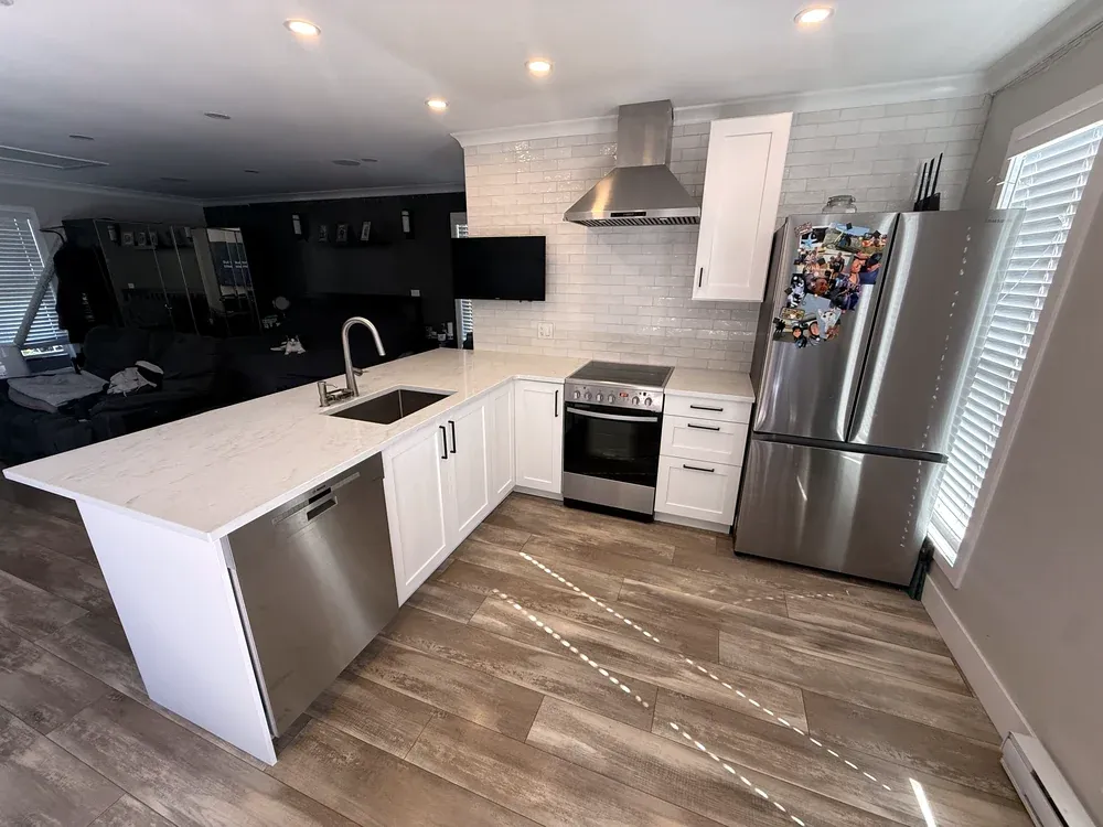 Refaced cabinets, extended counters, an undermount sink in South Surrey, after
